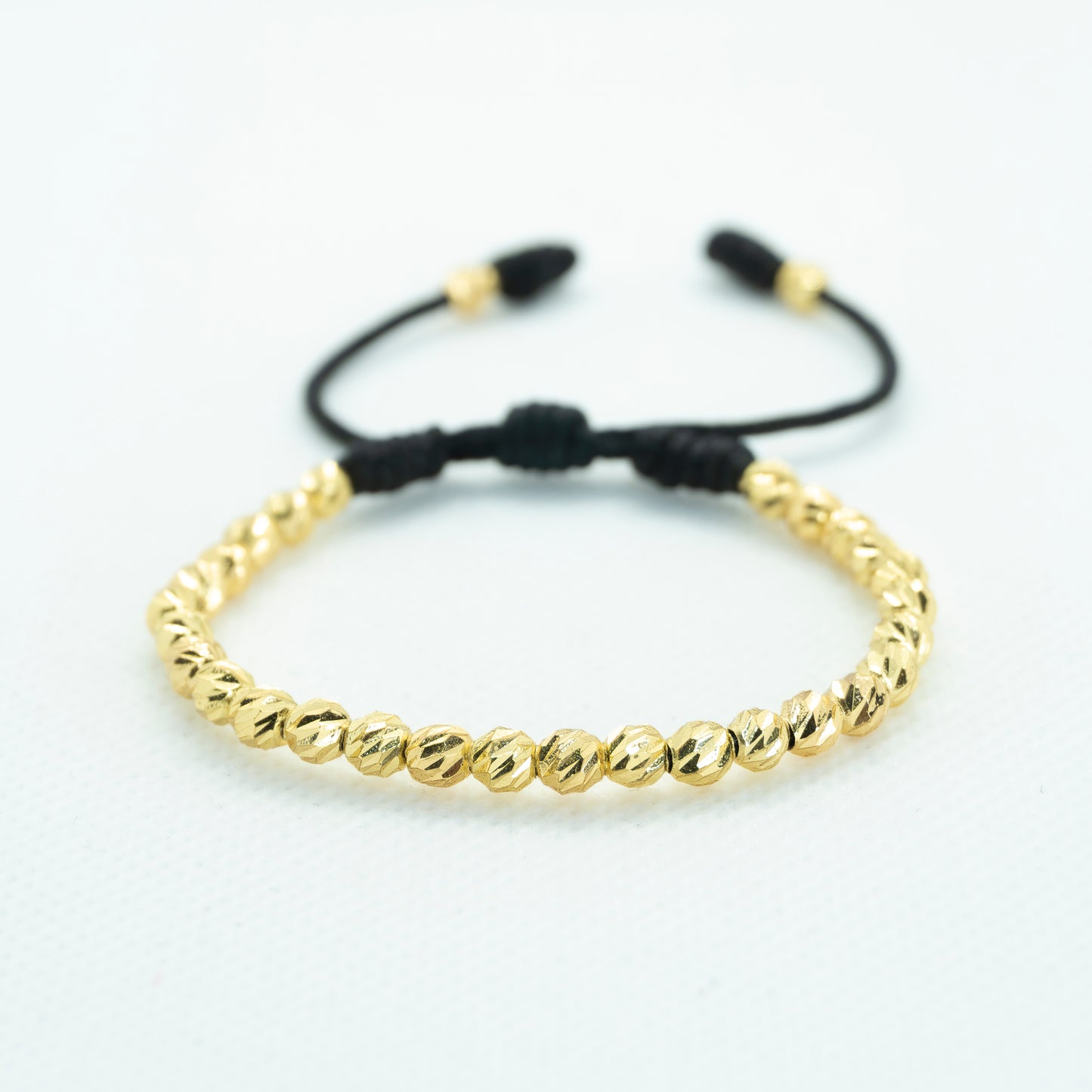 PULSERA TEJIDA CON BALIN DIAMANTADO