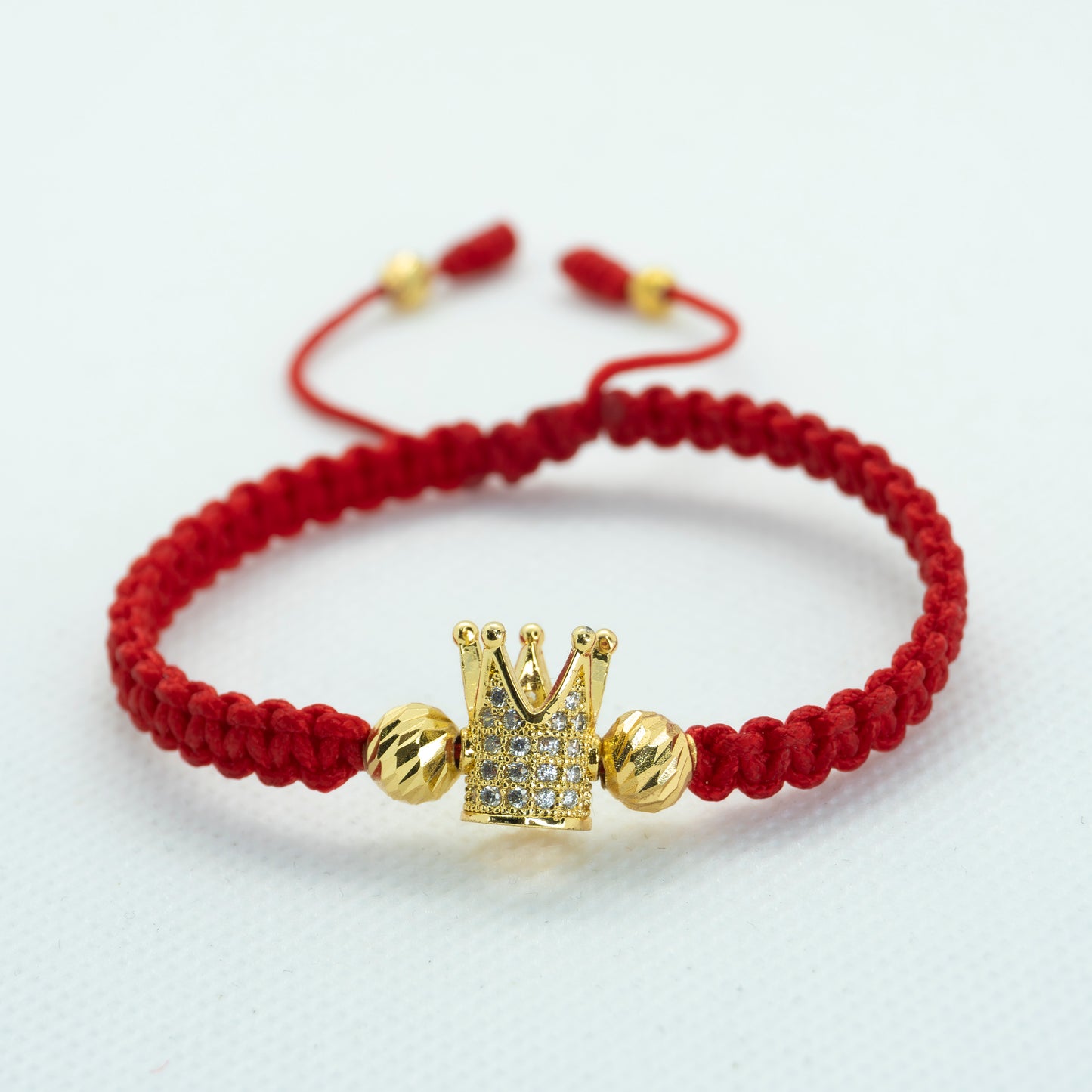 PULSERA TEJIDA DIJE CORONA