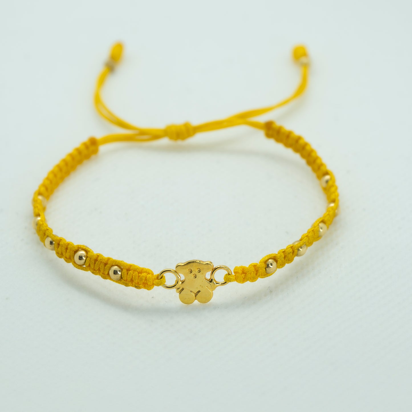 PULSERA TEJIDA CON DIJE OSO