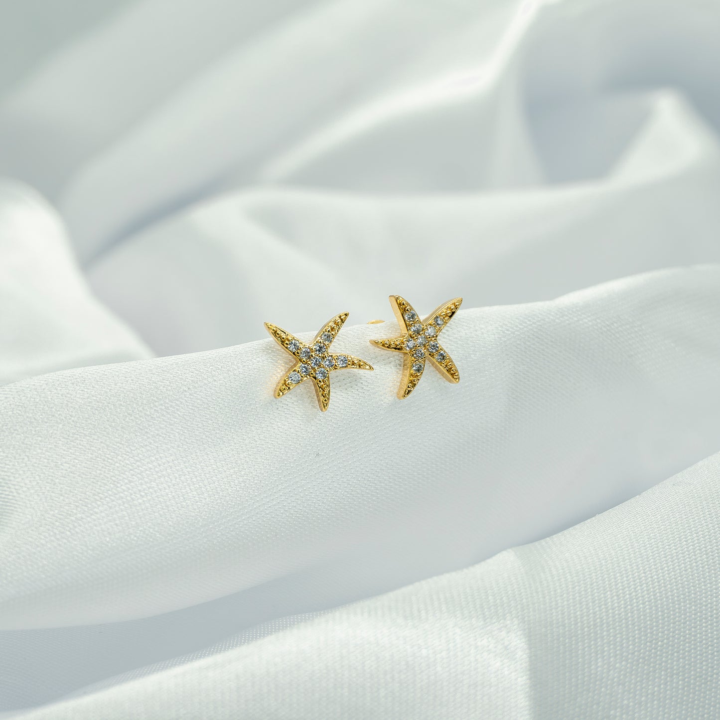 TOPO ESTRELLA DE MAR ZIRCONES BLANCOS