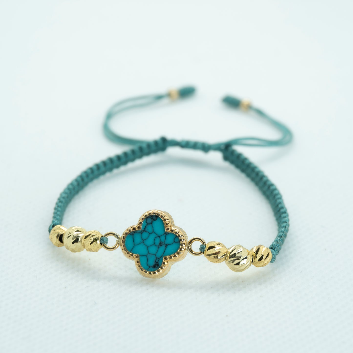 PULSERA TEJIDA VC. AZUL AGUAMARINA.