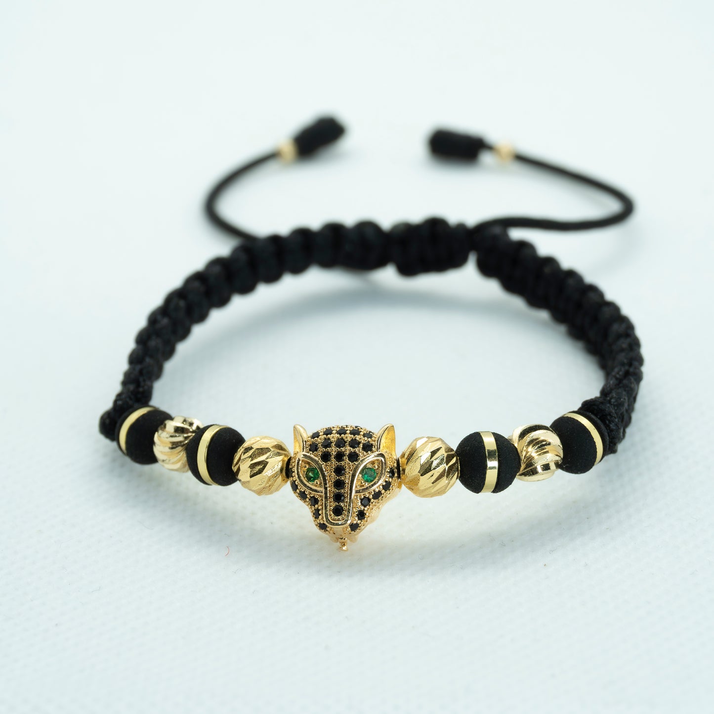 PULSERA TEJIDA CON DIJE PANTERA Y NEOPRENO NEGRO