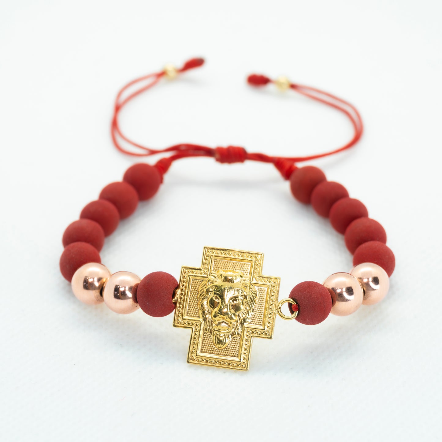 PULSERA TEJIDA CON NEOPRENO DIJE CRUZ LEON