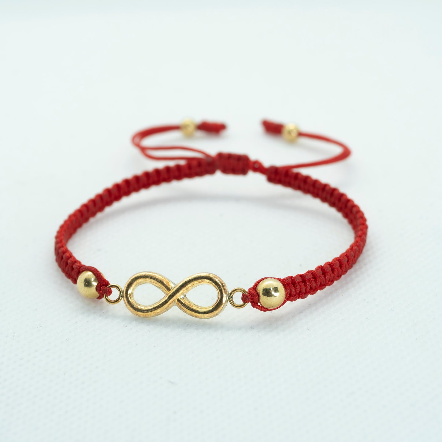 PULSERA TEJIDA CON DIJE INFINITO