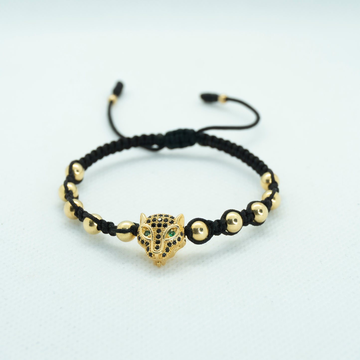 PULSERA TEJIDA CON DIJE PANTERA CIRCONES NEGROS
