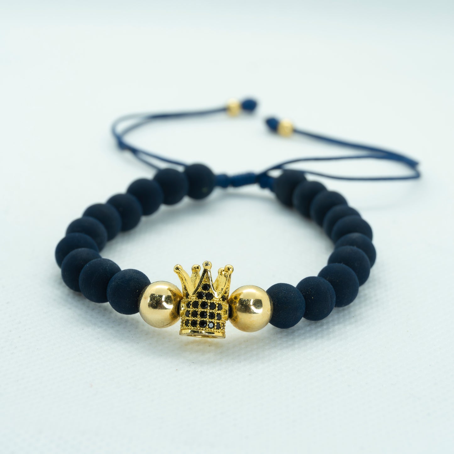 PULSERA TEJIDA NEOPRINO Y DIJE CORONA CIRCON