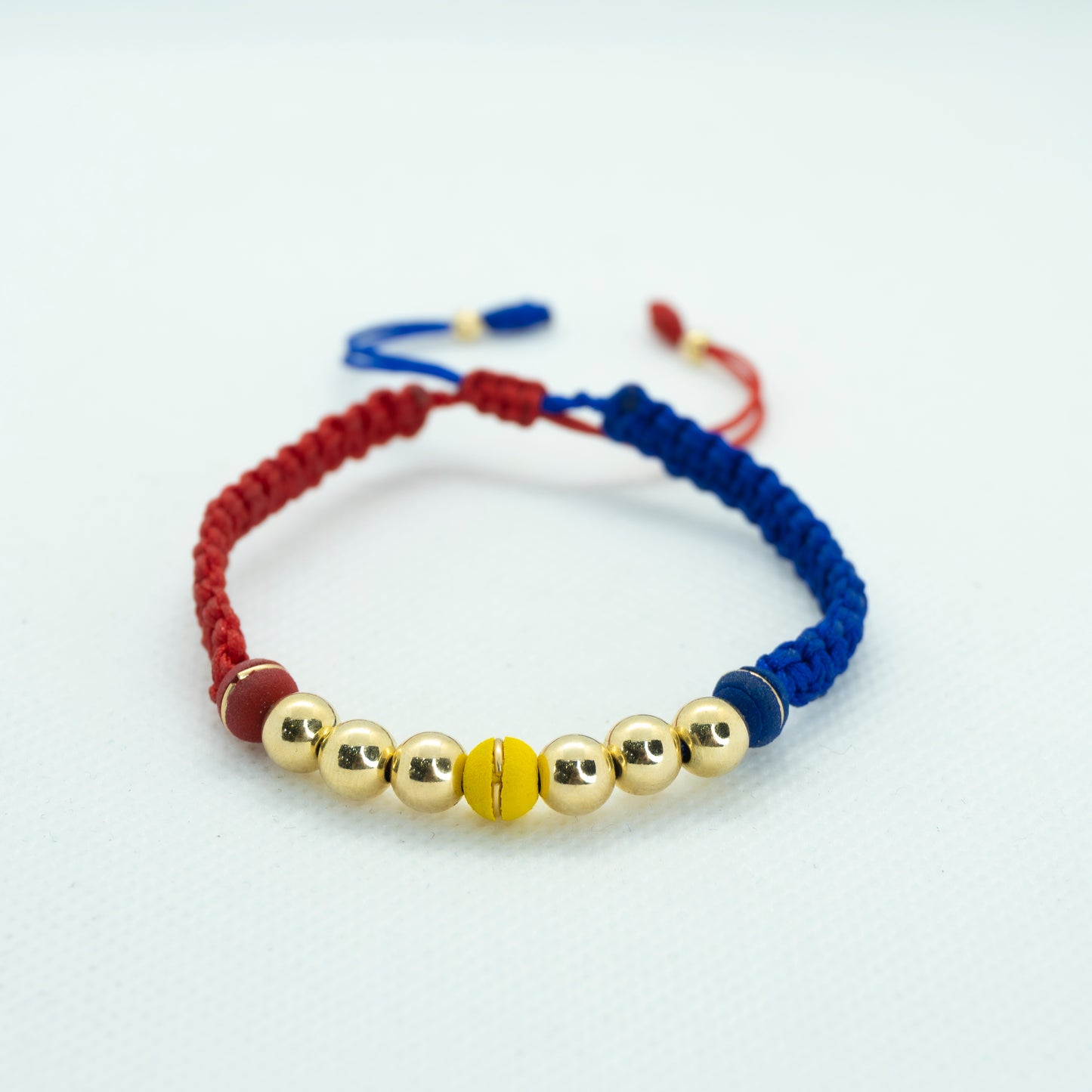 PULSERA TEJIDO COLOMBIA CON BALIN LISO