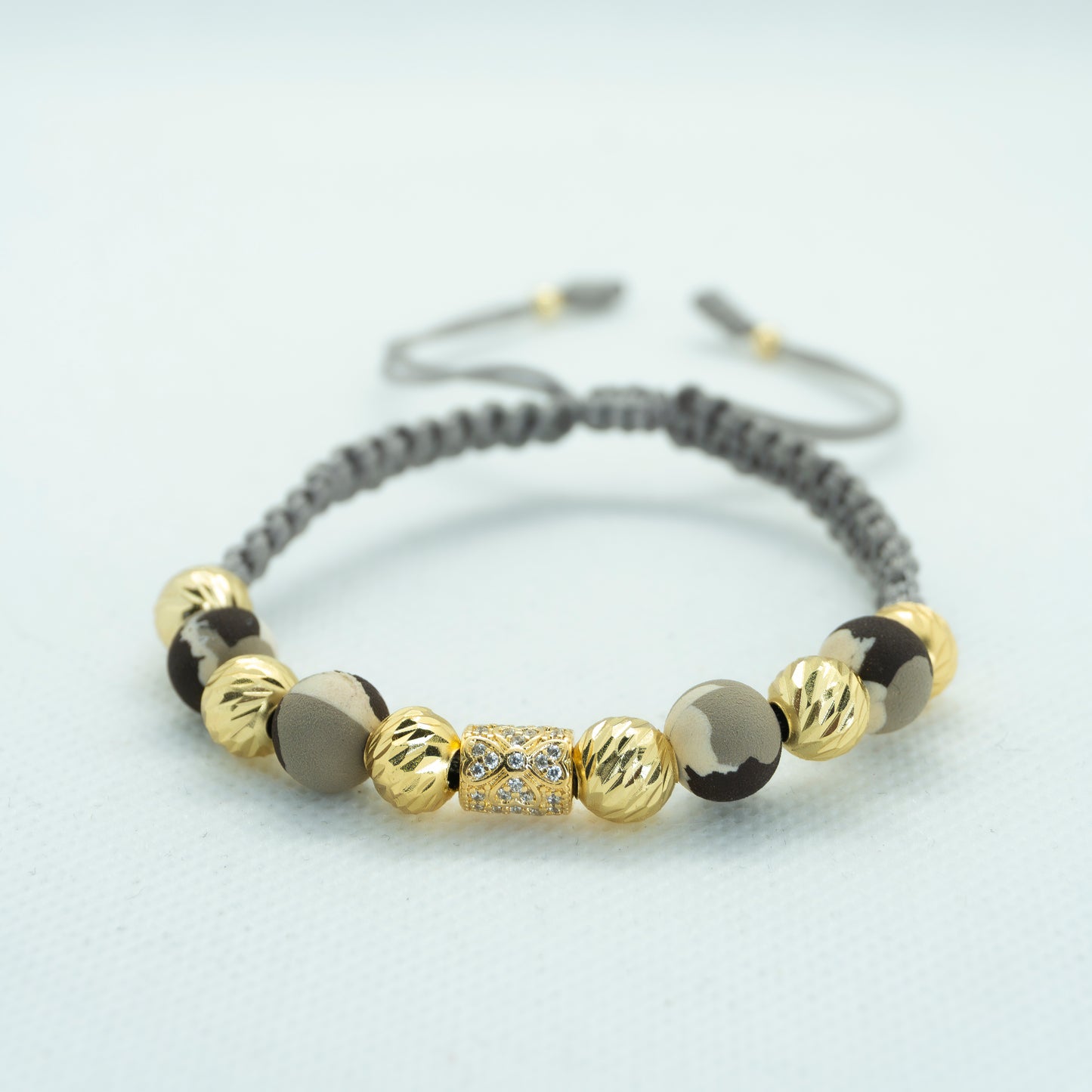 PULSERA TEJIDA NEOPRENO Y DIJE RONDEL CIRCON