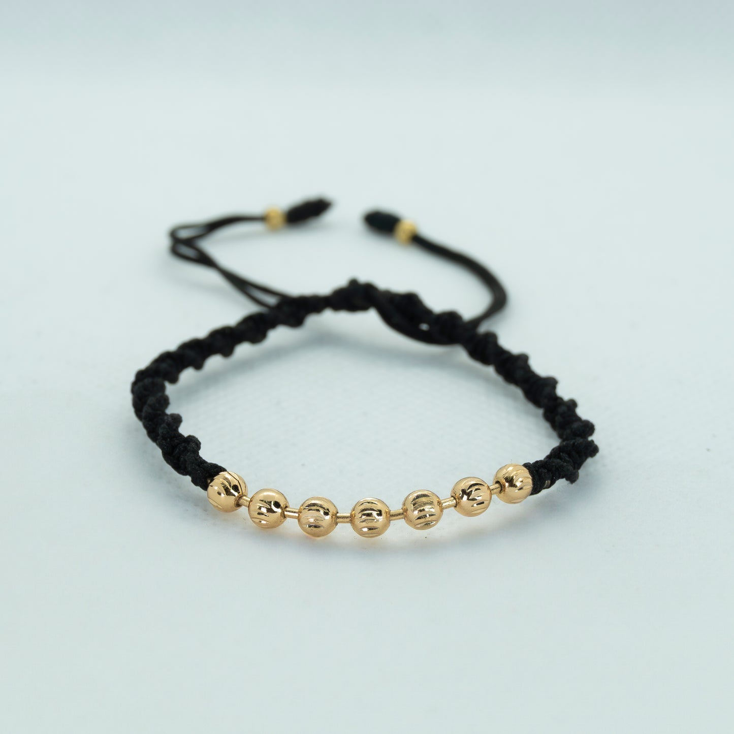 PULSERA TEJIDA CON BALIN DIAMANTADO AMARILLO