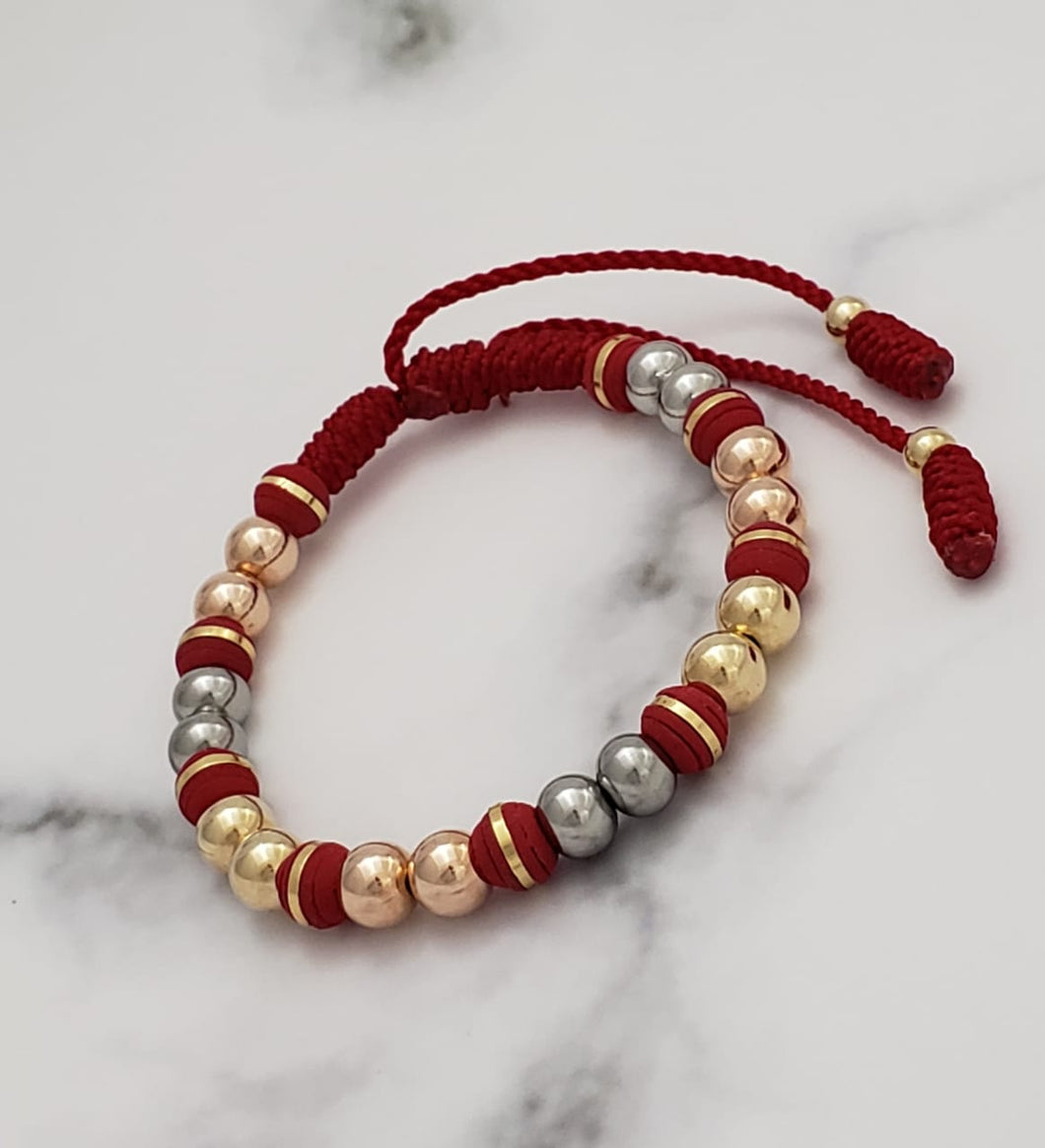 Brazalete elaborada toda en 6 mm roja tres oros