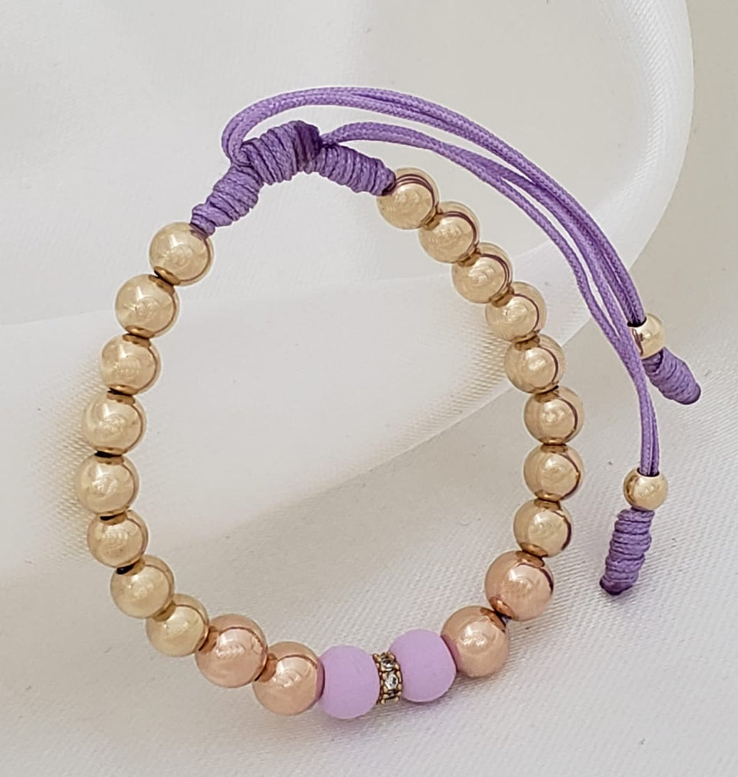 Brazalete bicolor para niño con balin liso 6 y 5 mm.